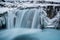 Hranabjargafoss waterfall surrounded by ice and snow during winter in Iceland CR2