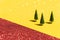 Hree fir trees on glittering yellow background with copyspace