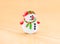 Hristmas decorative doll of snowman on wood