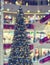 Ð¡hristmas tree in shopping mall, defoused holiday background