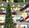 Ð¡hristmas tree in shopping mall, defoused holiday background