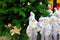 Ð¡hristmas tree, silver New Year s decorations. Funny white Snowmen and Santa Claus in a toy store. Festive Christmas winter trade