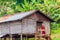 HSIPAW, MYANMAR - DECEMBER 1, 2016: Young Buddhist monk enters a village house on stilts near Hsipaw, Myanm