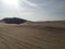 Huacachina Peru desert oasis lake and sand dunes