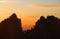 Huangshan Mountain in Anhui Province, China. Sunrise over Huangshan showing a detailed silhouette of the mountain ridge