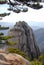 Huangshan Mountain in Anhui Province, China. View of a rocky outcrop framed by pine trees on the path to Lotus Peak