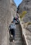 Huangshan Mountain in Anhui Province, China. Walkers ascending and descending steep steps at Narrow Cliff