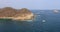 Huatulco Mexico island coast from moving ship 4K