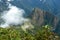 Huayna Picchu, or Wayna Pikchu, mountain in clouds rises over Machu Picchu Inca citadel, lost city of the Incas