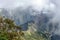 Huayna Picchu, or Wayna Pikchu, mountain in clouds rises over Machu Picchu Inca citadel, lost city of the Incas