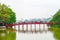 The Huc Bridge or Sun shine bridge at Hoan Kiem Lake, It`s a red wooden arch bridge