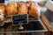 Huckleberry Bear Claw pasteries on display in Polebridge, Montana. Selective focus on the title of sign