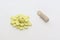 Huddle of yellow tablets with parting lines and neat stack of be