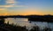 Hudson River at dusk in Hudson with lighthouse and boats