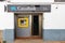 Huelva, Spain - March 1, 2021: ATM machine of Caixabank bank in Santa Ana La Real village, Huelva, Andalusia, Spain