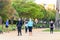 Huelva, Spain - May 5, 2020: Two women walking by a public park  wearing protective or medical face masks during the alarm state