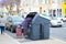 Huelva, Spain - May 6, 2020: A Homeless man searching for food in garbage. Hungry Man rummaging in trash container bin