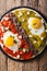 Huevos divorciados, fried eggs on corn tortillas with two salsas