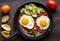 huevos rancheros with fried eggs with beans and avocado on a black pan