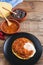 Huevos rancheros Mexican breakfast on a wooden base. Mexican cuisine. Copy space