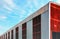 Huge Abandoned Metal Hangar Against a Blue Sky