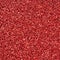 A huge amount of red decorative sequins. Background texture with shiny, small elements that reflect light in a random order. Glitt