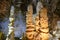 Huge ancient stalagmites closeup in the cages of Grotta di Frasassi, Genga, Marche, Italy.