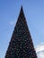 Huge artificial Christmas tree in a sunny day