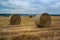 Huge bales of hay in the stubble