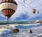 Huge balloons, sea, a spring storm