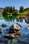 Huge basalt boulders reflected in the lake