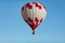 A huge, beautiful balloon in the cloudless blue sky