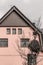 Huge bird nest in front of a pink house