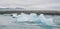 Huge blocks of ice on Glacial river and blue icebergs on Jokulsarlon glacier lake. Vatnajokull National Park, Iceland