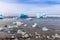 Huge blue icebergs drifting along the fjord, view from old harbor in Nuuk city, Greenland