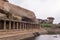 Huge boulder hangs over gallery at Krishna Tank, Hampi, Karnataka, India