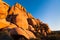 Huge boulders and Joshua trees glowing in the light of sunset