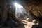 huge boulders and rubble filling the entrance of a mountain cave, with sunlight shining through