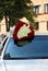 A huge bouquet of hundreds of red and white roses on the roof of the car