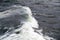 Huge breaking waves surge towards shore