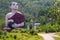 Huge burmese monk statue near the statue Win Sein Taw Ya in Kyauktalon Taung, near Mawlamyine, Myanmar.