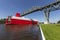 Huge car carrier passing railway bridge on Kiel Canal