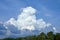 A huge cloud of bizarre shape. Cloudy sky before the storm