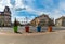 Huge colorful flower pots next to intersection at city center