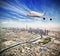 Huge commercial jetliner flying above Dubai city, UAE.