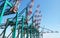 Huge container handling gantry cranes at a container terminal. Blue sky