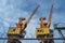 Huge cranes at a port, logistics concept beyond security barbed