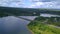 The huge Crimean bridge. Clip. A bridge passing through a long river against the background of forests and blue sky.