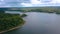 The huge Crimean bridge. Clip. A bridge passing through a long river against the background of forests and blue sky.