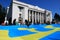 A huge Crimean Tatar flag was unfurled near the Verkhovna Rada of Ukraine. Crimean Tatars hold a large blue flag with a yellow